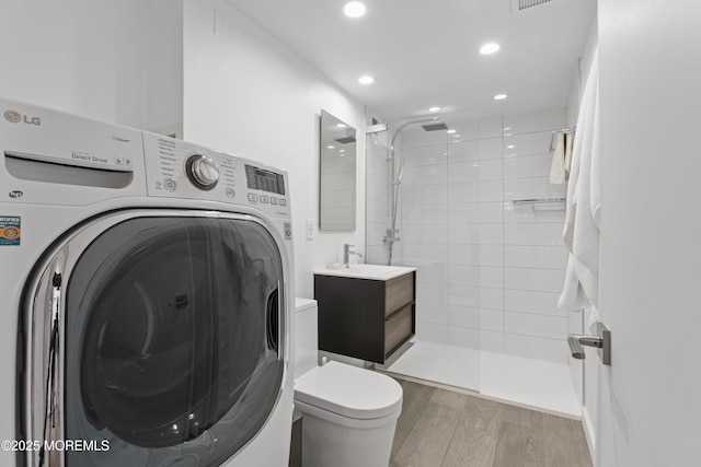 138 Bodman Pl Unit 5, Red Bank, NJ 07701 - bathroom with washer / dryer, wood finished floors, a tile shower, recessed lighting, and vanity
