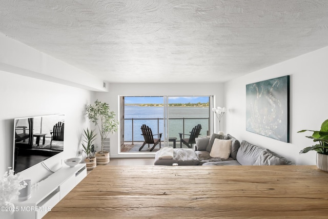 138 Bodman Pl Unit 5, Red Bank, NJ 07701 - living room featuring a textured ceiling and wood finished floors