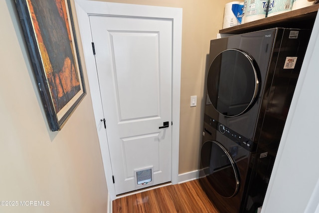 131 Locust St, Tuckerton, NJ 08087 - laundry room featuring stacked washer / dryer, laundry area, visible vents, dark wood-style flooring, and baseboards