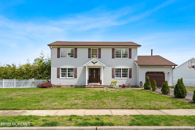 131 Locust St, Tuckerton, NJ 08087 - colonial inspired home featuring a front lawn, an attached garage, and fence