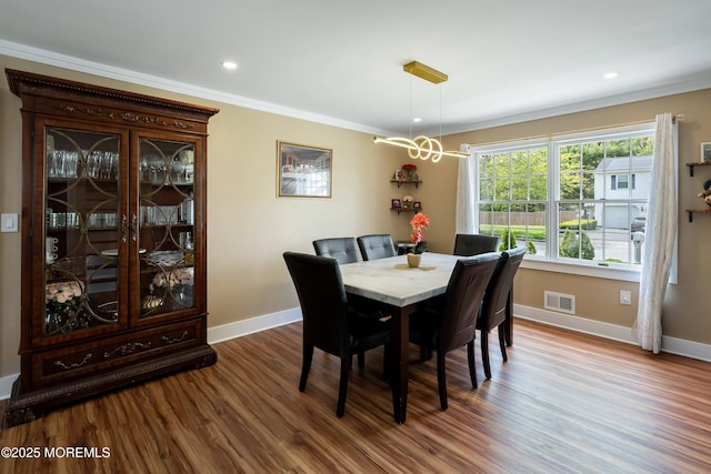 131 Locust St, Tuckerton, NJ 08087 - dining room featuring visible vents, baseboards, ornamental molding, and dark wood-type flooring