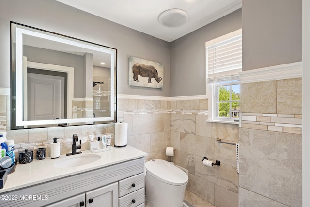 131 Locust St, Tuckerton, NJ 08087 - full bath featuring toilet, tiled shower, tile walls, wainscoting, and vanity