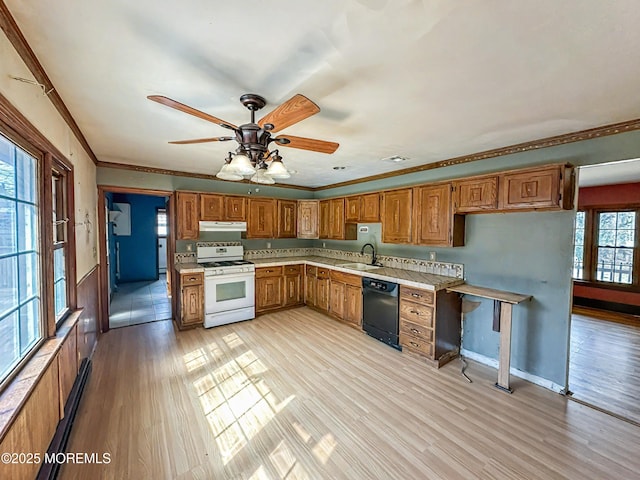 kitchen with a sink, black dishwasher, brown cabinets, white gas range, and under cabinet range hood