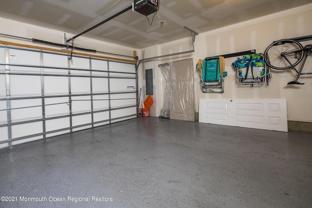 600 Grand Ave Unit 7C, Asbury Park, NJ 07712 - garage with electric panel and a garage door opener