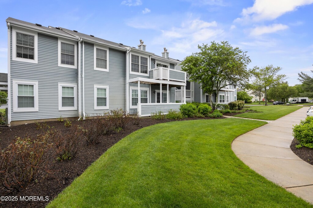 141 Cypress Ct, Howell, NJ 07731 - back of house with a yard and a chimney