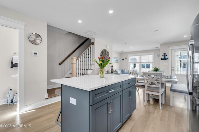 6 Shell Rd, Mantoloking, NJ 08738 - kitchen featuring light wood-type flooring, a kitchen island, light countertops, open floor plan, and recessed lighting