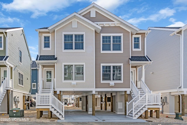 6 Shell Rd, Mantoloking, NJ 08738 - view of front facade with stairway and a carport