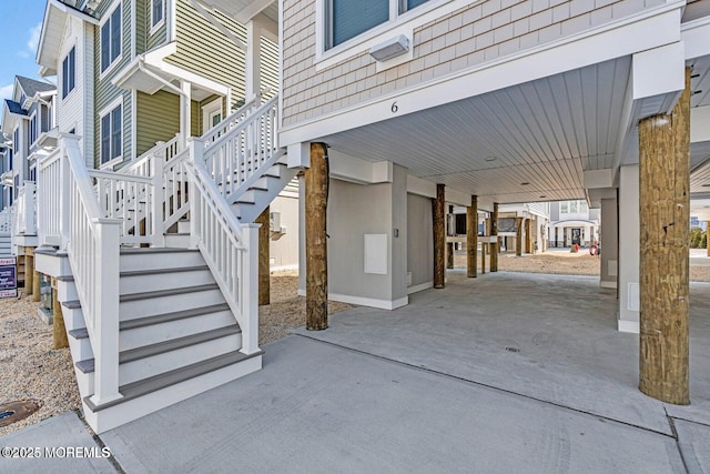 6 Shell Rd, Mantoloking, NJ 08738 - view of patio featuring stairway and concrete driveway