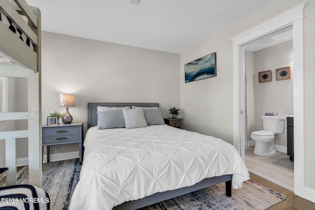 6 Shell Rd, Mantoloking, NJ 08738 - bedroom with wood finished floors, connected bathroom, and baseboards