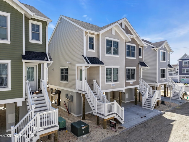 6 Shell Rd, Mantoloking, NJ 08738 - back of house featuring stairway, a patio, and a shingled roof
