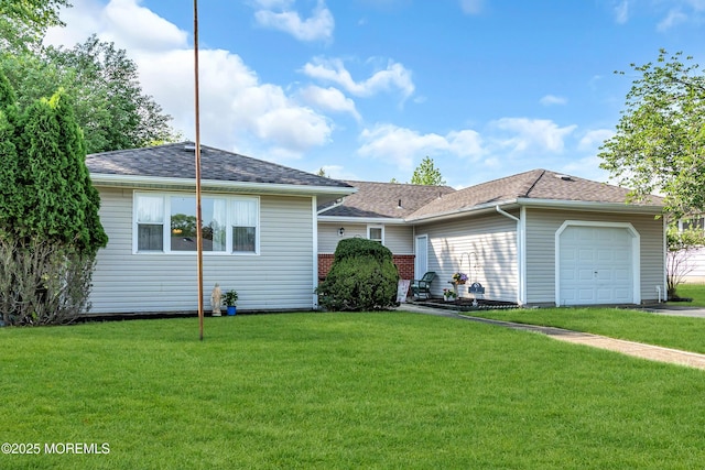 view of front of home featuring a garage, a front yard, and roof with shingles