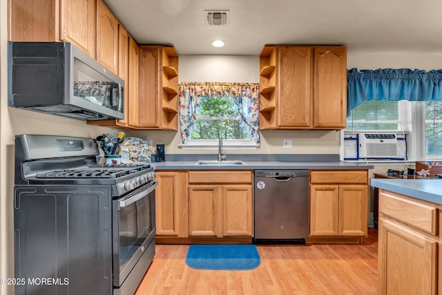 kitchen with stainless steel appliances, a sink, open shelves, light wood-style flooring, and cooling unit