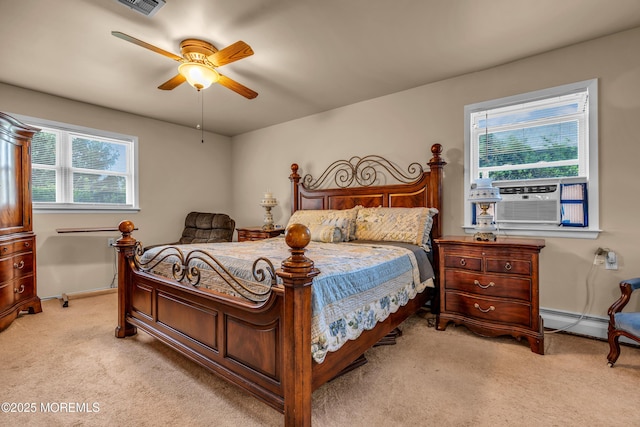 bedroom with light carpet, multiple windows, and cooling unit