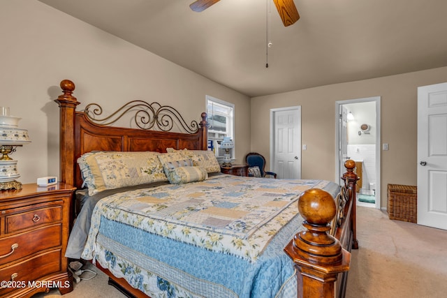 bedroom with light carpet, a ceiling fan, and ensuite bathroom