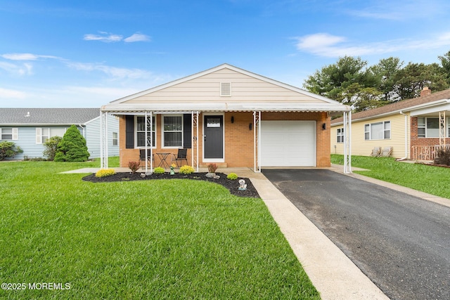9 Zapata Ct, Toms River, NJ 08757 - view of front of property with a porch, a garage, asphalt driveway, brick siding, and a front yard