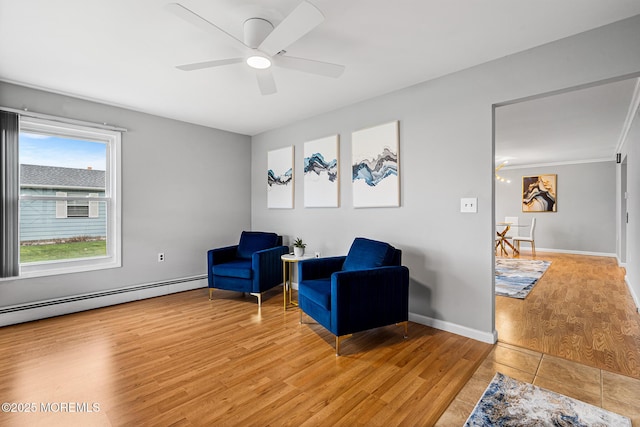 9 Zapata Ct, Toms River, NJ 08757 - living area featuring a baseboard radiator, light wood-type flooring, ceiling fan, and baseboards