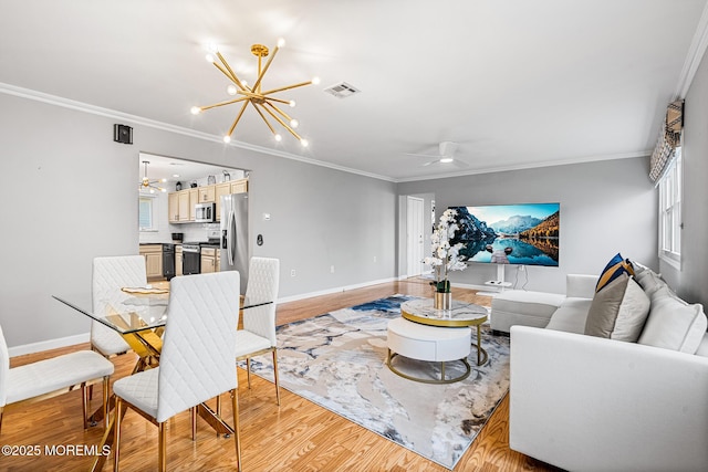 9 Zapata Ct, Toms River, NJ 08757 - living area with a chandelier, ornamental molding, light wood-style floors, baseboards, and a ceiling fan