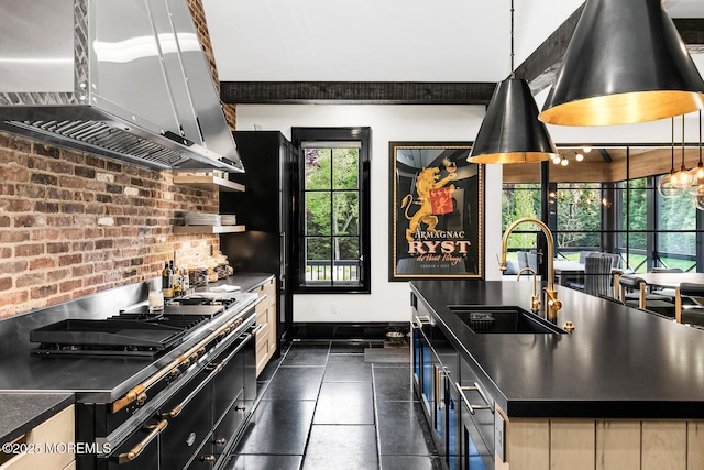 5 Laurel Ln, Rumson, NJ 07760 - kitchen with wall chimney exhaust hood, a sink, dark countertops, black range oven, and a center island with sink