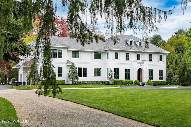 5 Laurel Ln, Rumson, NJ 07760 - view of front of home with a chimney, stucco siding, and a front yard