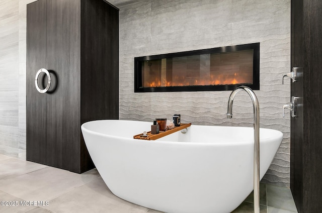 5 Laurel Ln, Rumson, NJ 07760 - bathroom with a freestanding bath, tile patterned floors, and a brick fireplace