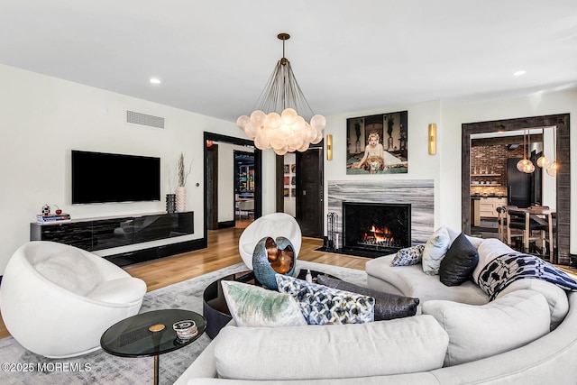 5 Laurel Ln, Rumson, NJ 07760 - living room featuring wood finished floors, a fireplace, recessed lighting, and a chandelier
