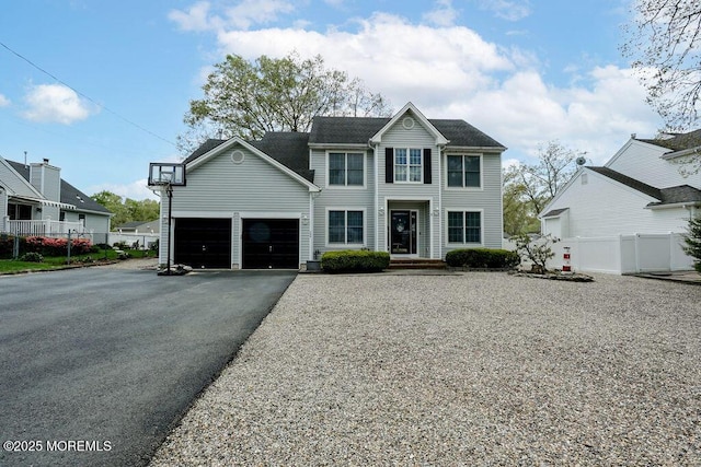 204 Stormy Rd, Manahawkin, NJ 08050 - view of front facade featuring fence, asphalt driveway, and an attached garage