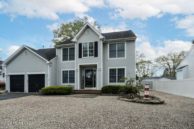 204 Stormy Rd, Manahawkin, NJ 08050 - traditional home featuring fence, driveway, and an attached garage