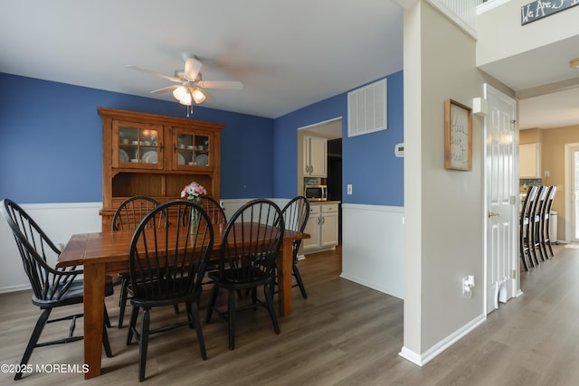 204 Stormy Rd, Manahawkin, NJ 08050 - dining room with a ceiling fan, wood finished floors, and baseboards