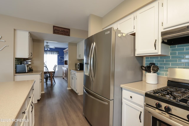 204 Stormy Rd, Manahawkin, NJ 08050 - kitchen featuring stainless steel appliances, ceiling fan, white cabinets, premium range hood, and dark wood-style flooring