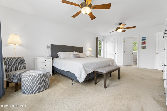 bedroom featuring light colored carpet, multiple windows, a ceiling fan, and baseboards