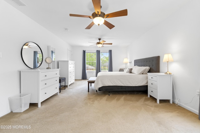 bedroom with light carpet and baseboards