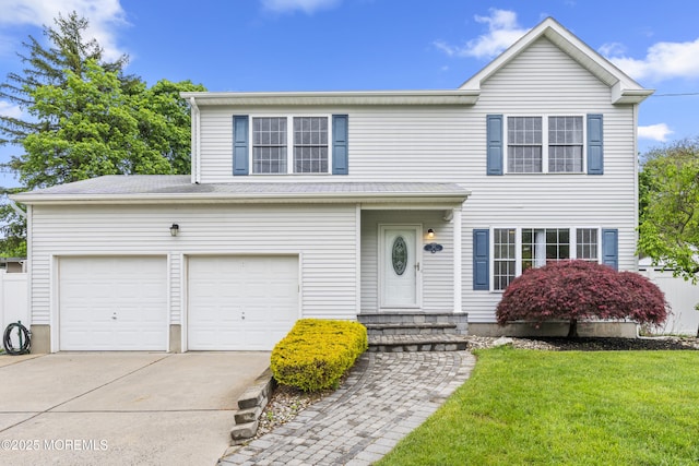 traditional home featuring concrete driveway and a front lawn