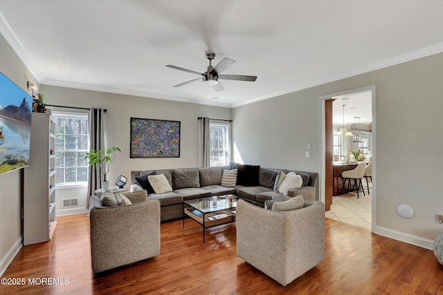 460 Christine Ct, Freehold, NJ 07728 - living area featuring ceiling fan, crown molding, baseboards, and wood finished floors