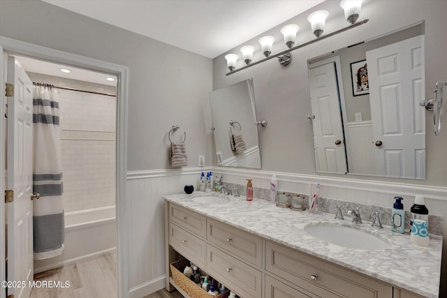 460 Christine Ct, Freehold, NJ 07728 - full bathroom with double vanity, shower / tub combo, a wainscoted wall, and a sink