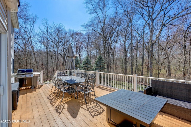 460 Christine Ct, Freehold, NJ 07728 - wooden deck featuring a forest view and outdoor dining space
