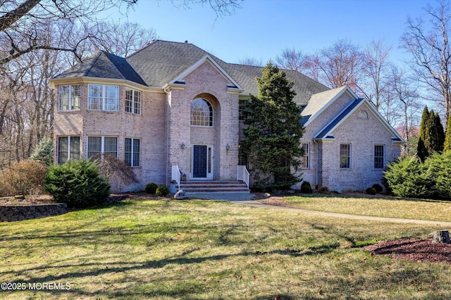 460 Christine Ct, Freehold, NJ 07728 - traditional-style home featuring a front lawn and brick siding