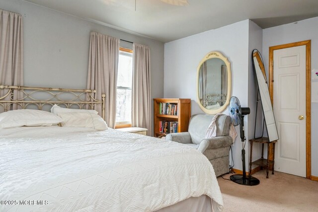 carpeted bedroom with baseboards