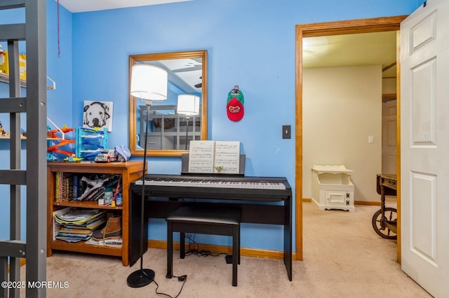 sitting room with carpet, an office area, and baseboards