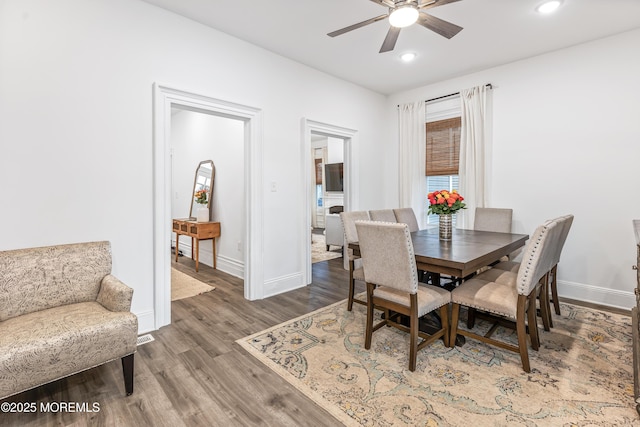 dining area featuring ceiling fan, wood finished floors, baseboards, and recessed lighting