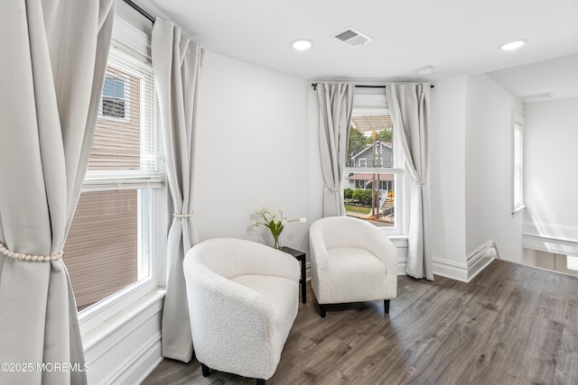 sitting room with wood finished floors, recessed lighting, and baseboards