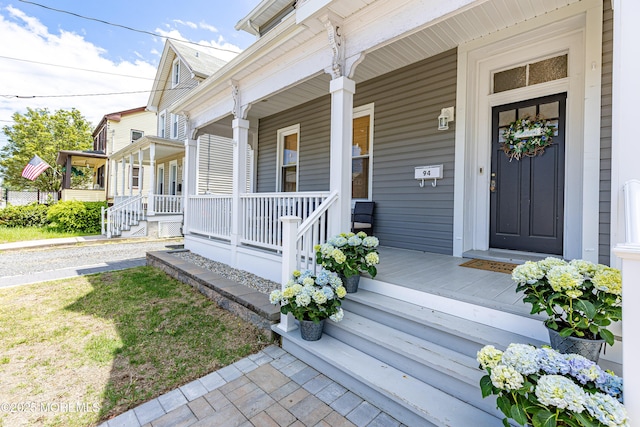 entrance to property featuring a porch