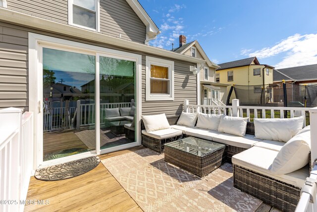 wooden terrace with outdoor lounge area