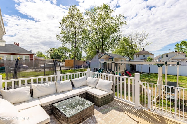 view of patio / terrace featuring a playground, an outdoor living space, and a residential view