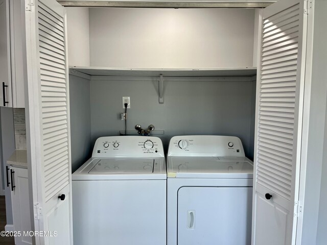 laundry room with washer and dryer