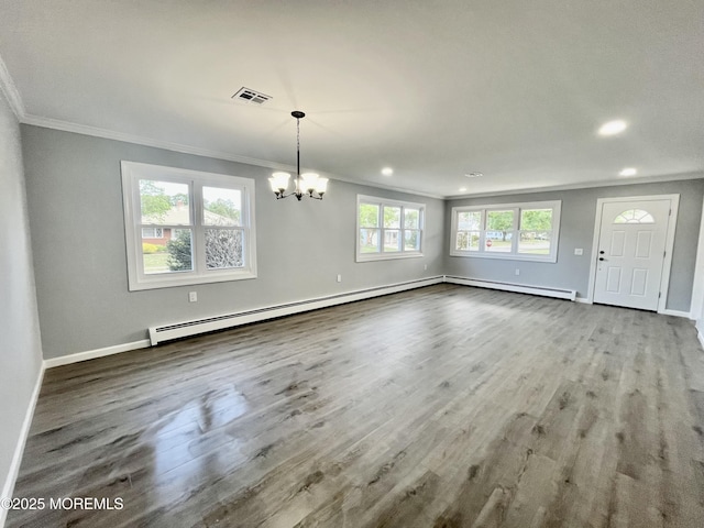unfurnished living room with ornamental molding, a chandelier, wood finished floors, baseboards, and recessed lighting