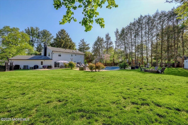 733 Colts Neck Rd, Freehold, NJ 07728 - view of green lawn featuring a patio area and an outdoor pool