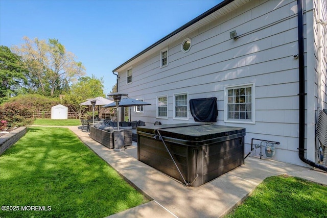 733 Colts Neck Rd, Freehold, NJ 07728 - rear view of property featuring a storage shed, an outdoor living space, a hot tub, an outbuilding, and a lawn