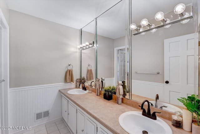 733 Colts Neck Rd, Freehold, NJ 07728 - full bath featuring wainscoting, tile patterned flooring, and double vanity