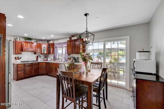 733 Colts Neck Rd, Freehold, NJ 07728 - dining area with light tile patterned flooring, a chandelier, and recessed lighting