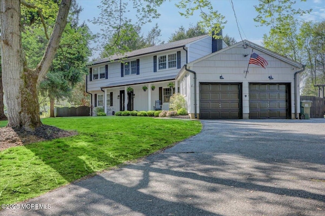 733 Colts Neck Rd, Freehold, NJ 07728 - colonial inspired home with an attached garage, covered porch, and driveway